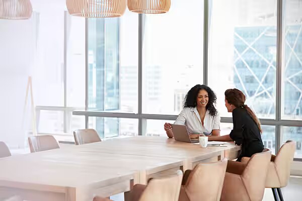 Employees discussing in office