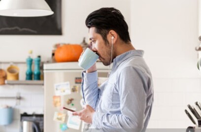 man-drinking-in-kitchen