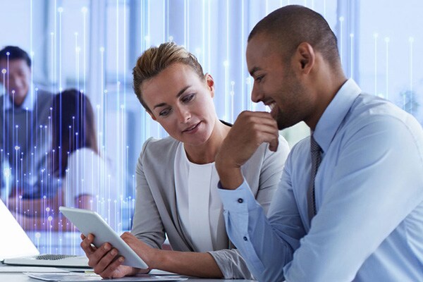 Employees working in office, overlaid with OpenBlue graphics