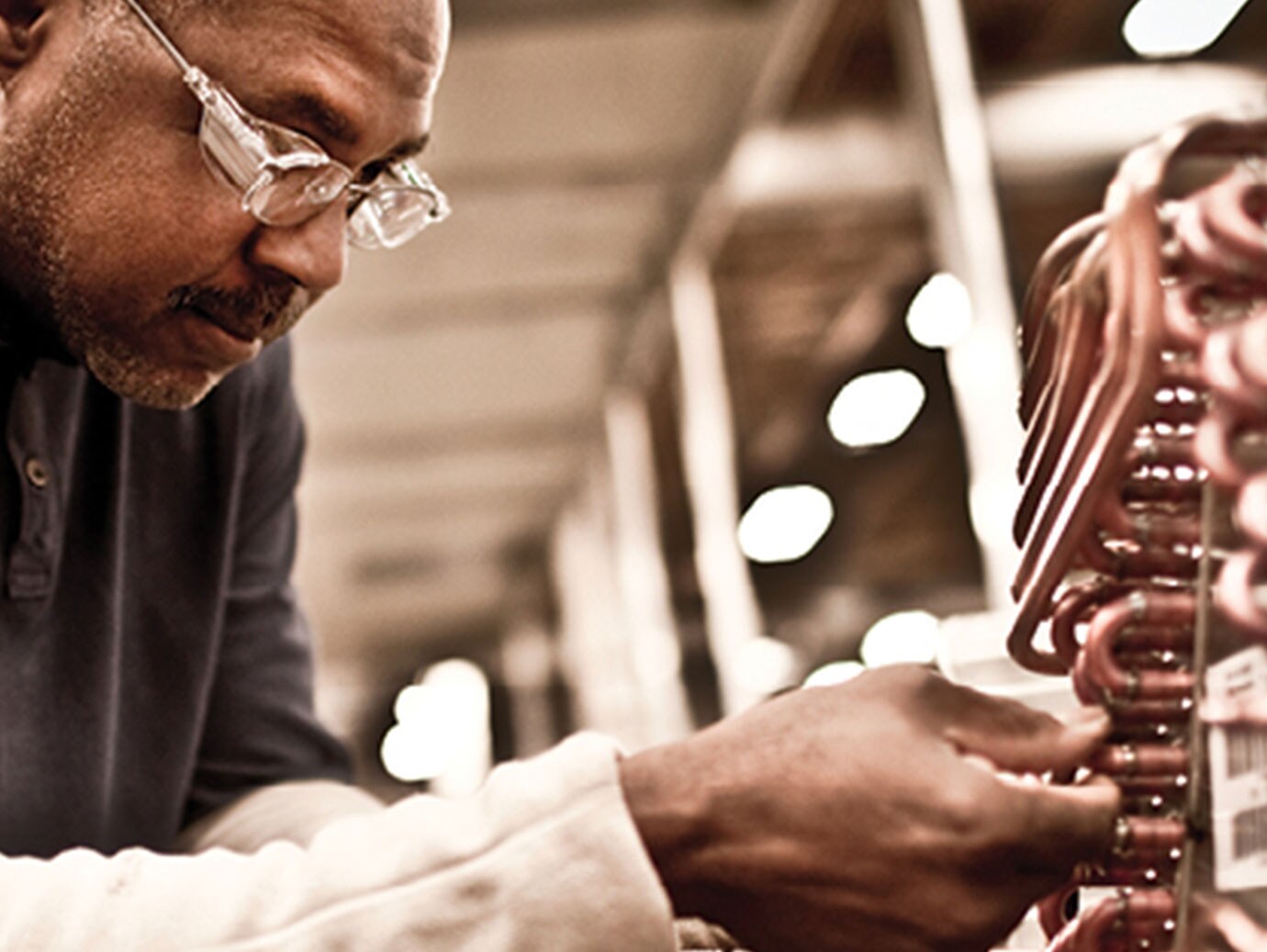Man working on a heating and cooling system